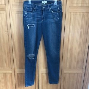 Women’s skinny distressed jeans.